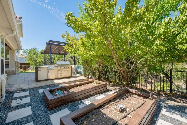 a view of a backyard with sitting area
