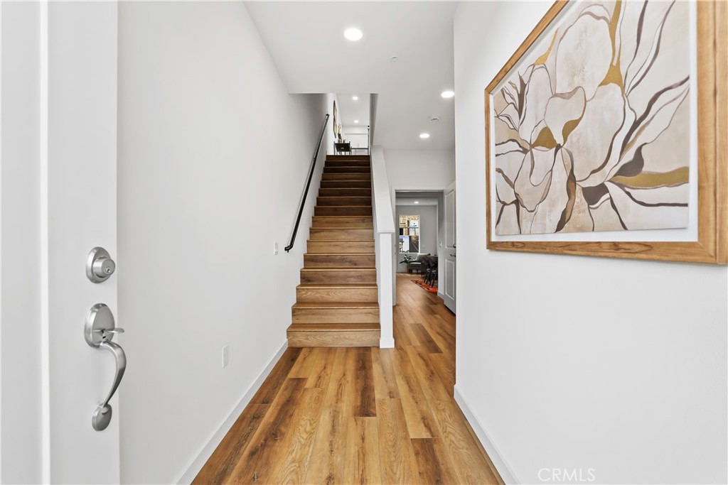 53 Bigsby Drive Stanton, CA 90680 - Photo 3 of 48 a view of a hallway with wooden floor and entryway