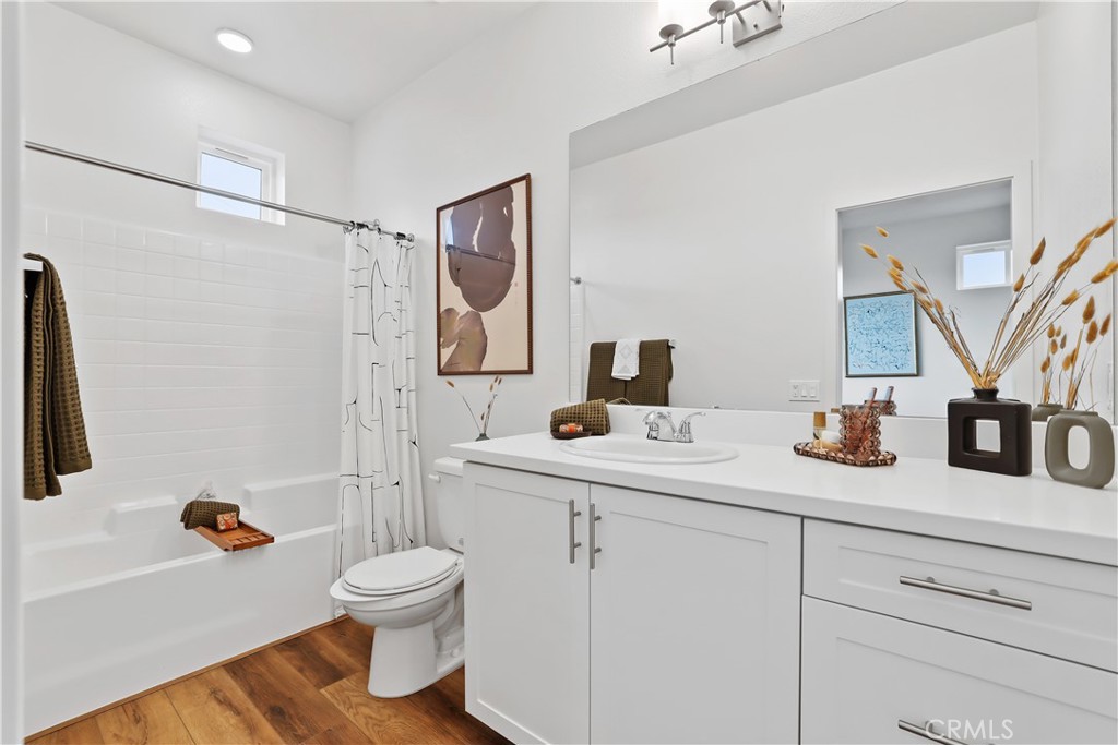 53 Bigsby Drive Stanton, CA 90680 - Photo 37 of 48 a bathroom with a sink toilet and shower