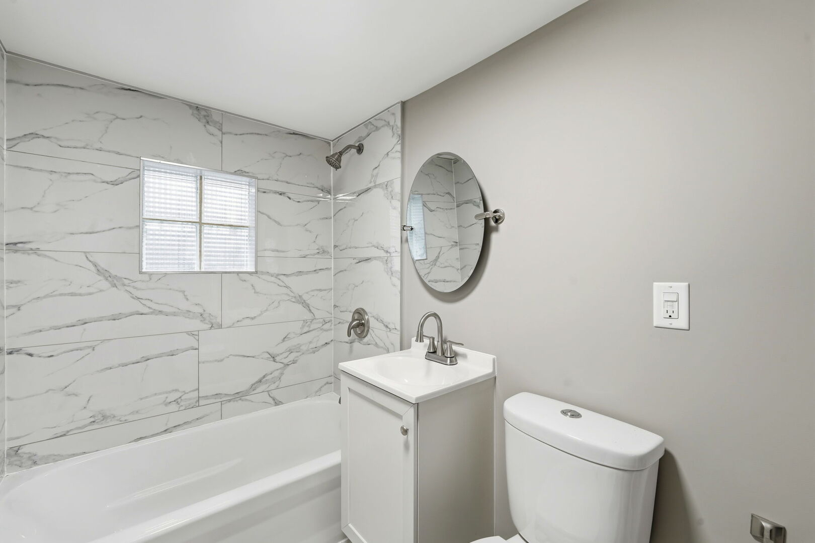 1217 North Harding Avenue Chicago, IL 60651 - Photo 26 of 45 a bathroom with a toilet sink and mirror