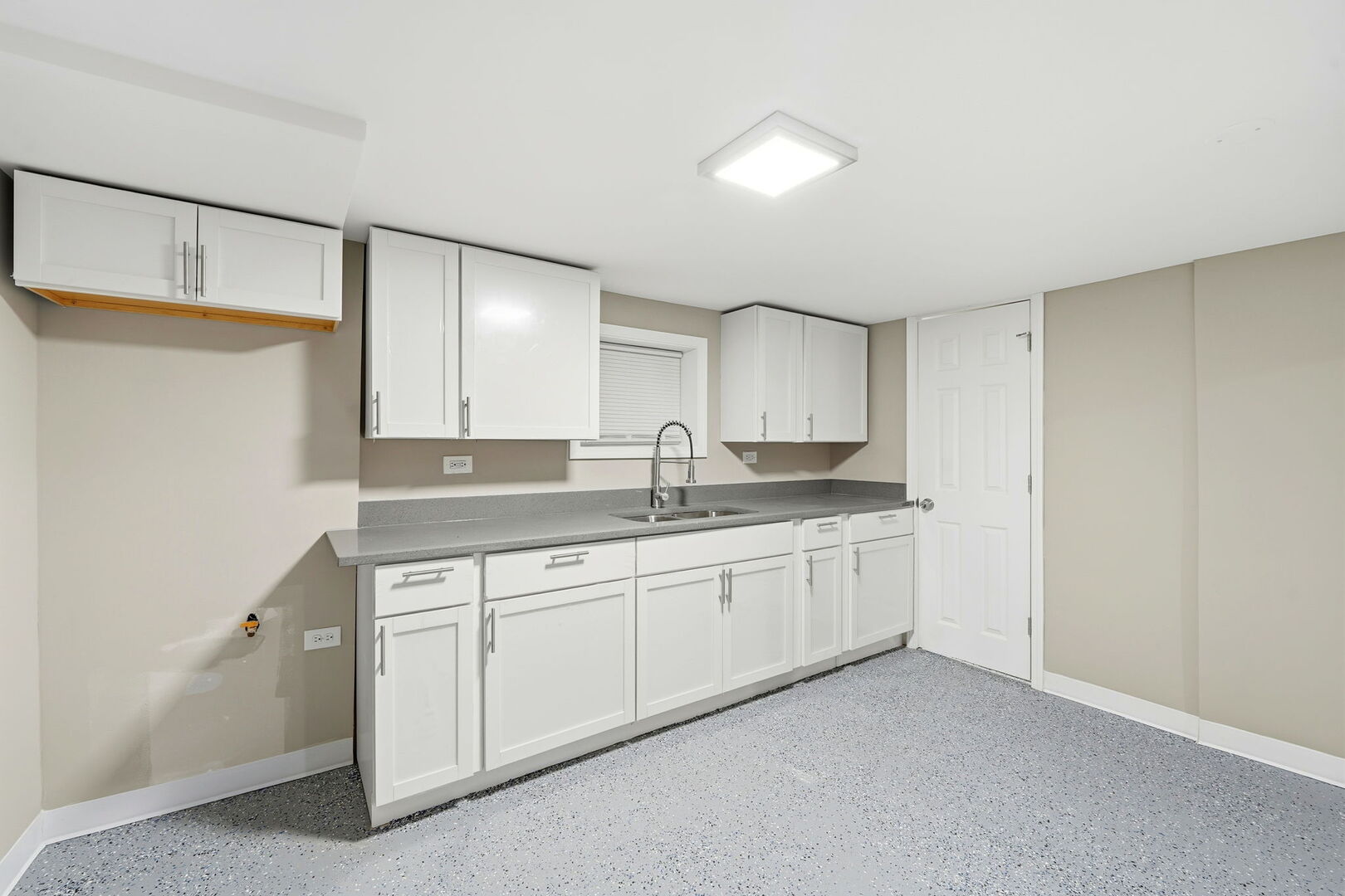 1217 North Harding Avenue Chicago, IL 60651 - Photo 29 of 45 a spacious bathroom with a granite countertop sink and a mirror