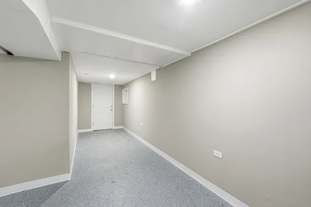 a white toilet sitting next to a bathroom sink