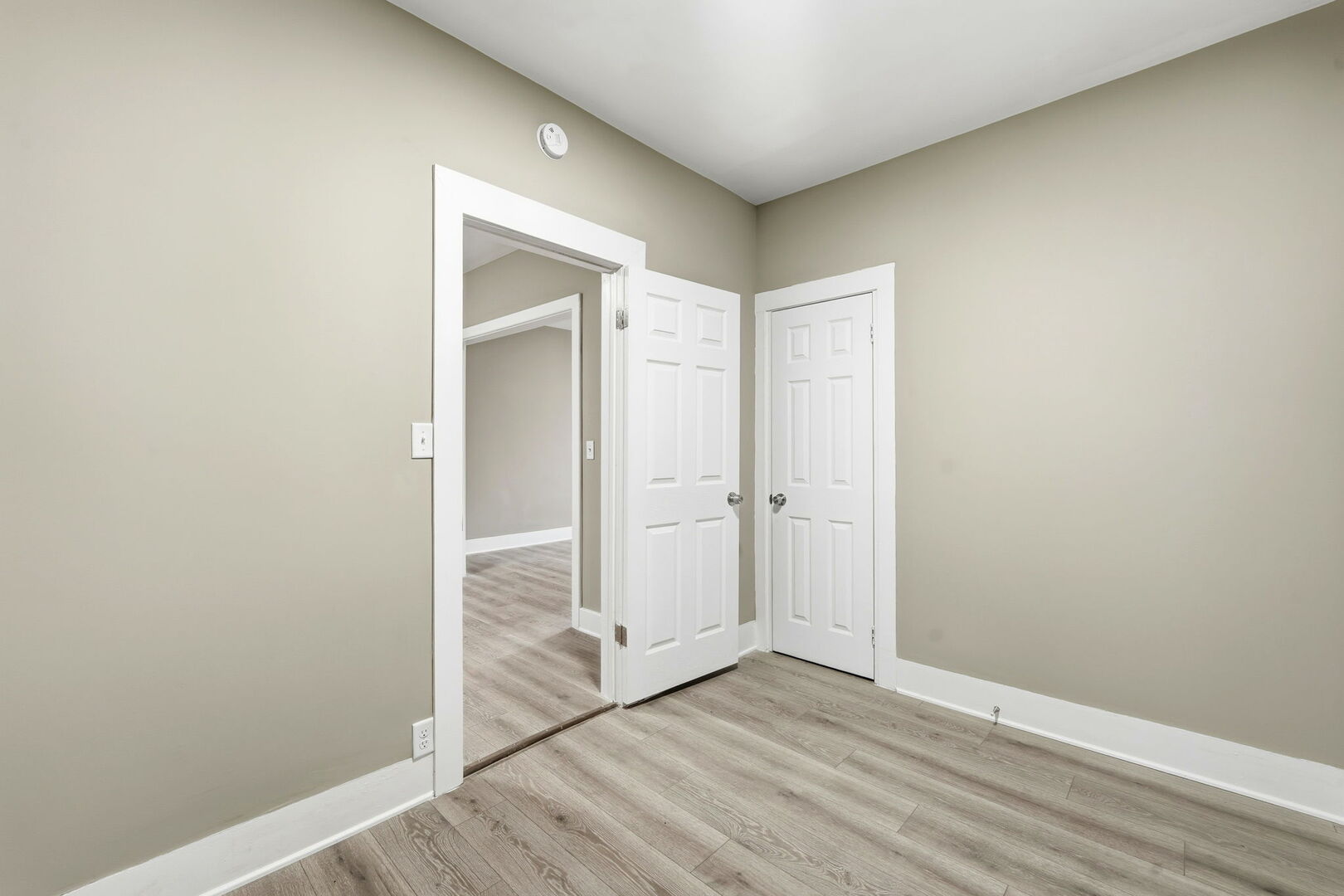 1217 North Harding Avenue Chicago, IL 60651 - Photo 9 of 45 a view of an empty room with wooden floor