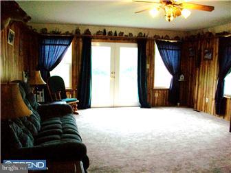 140 Harris Road Mannington, NJ 08079 - Photo 2 of 12 a living room with furniture and a fireplace
