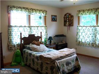 140 Harris Road Mannington, NJ 08079 - Photo 9 of 12 a bedroom with a bed and a window
