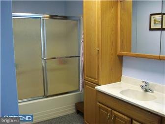 140 Harris Road Mannington, NJ 08079 - Photo 10 of 12 a bathroom with a granite countertop sink and a mirror