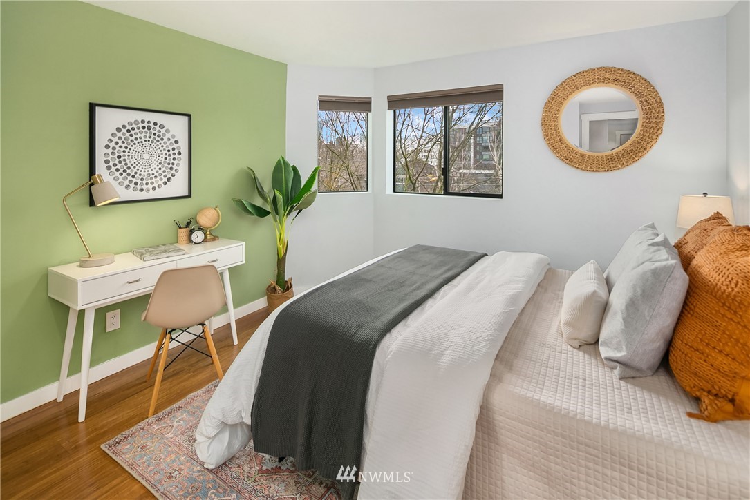 116 11th Avenue East, Unit 402 Seattle, WA 98102 - Photo 14 of 22 a bedroom with a bed and a window