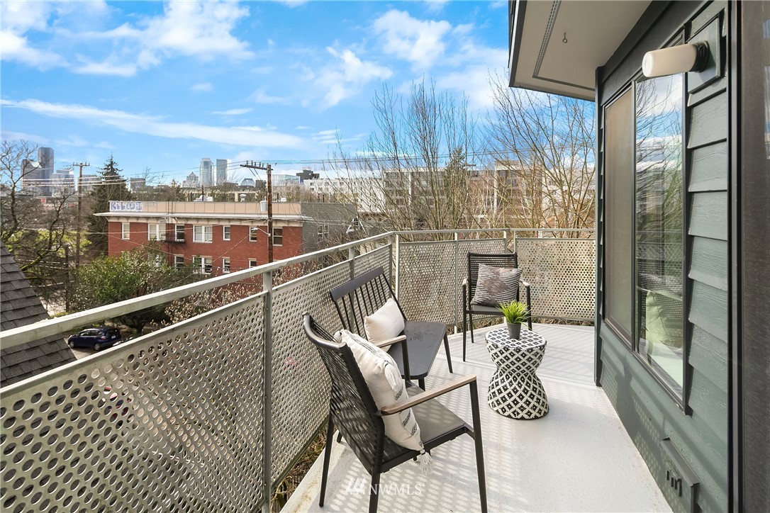 116 11th Avenue East, Unit 402 Seattle, WA 98102 - Photo 17 of 22 a view of a balcony with chairs