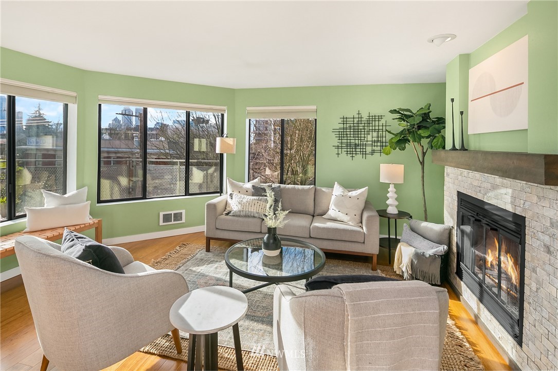 116 11th Avenue East, Unit 402 Seattle, WA 98102 - Photo 3 of 22 a living room with furniture and a large window