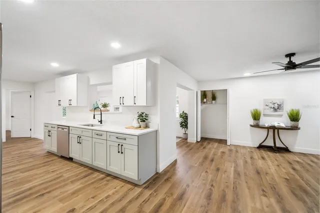 a kitchen with a sink and cabinets