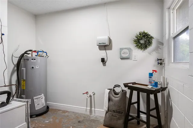 a house that has a table and chairs in patio