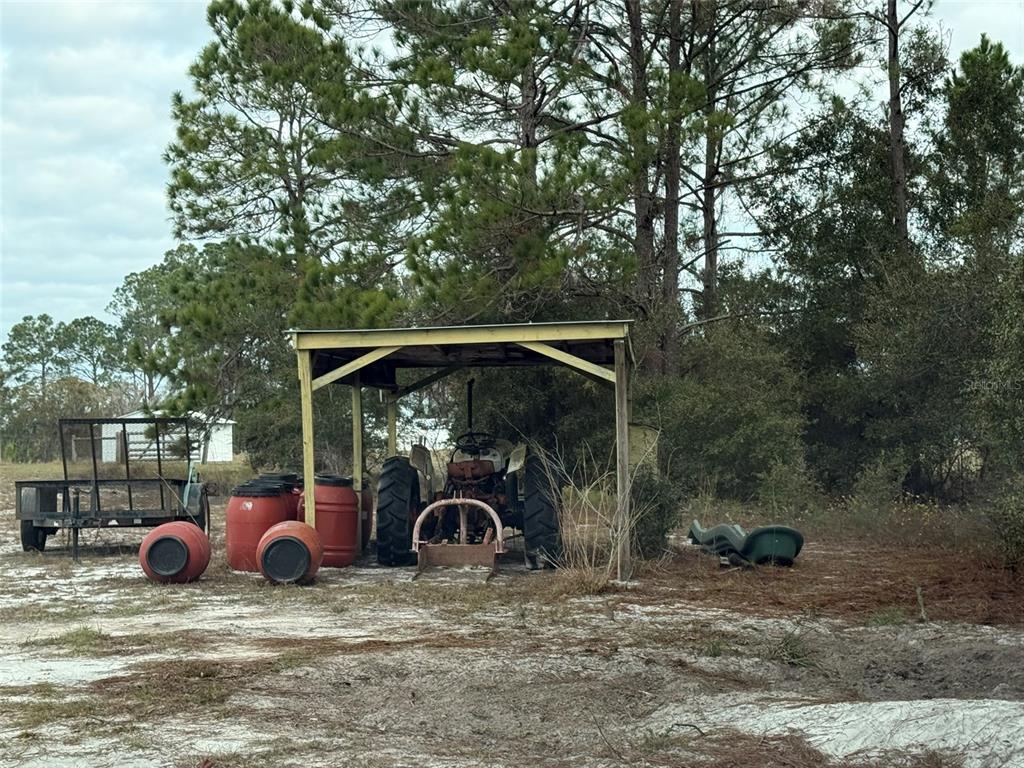 29605 Fullerville Road DeLand, FL 32720 - Photo 23 of 37 a view of a two chair under an umbrella