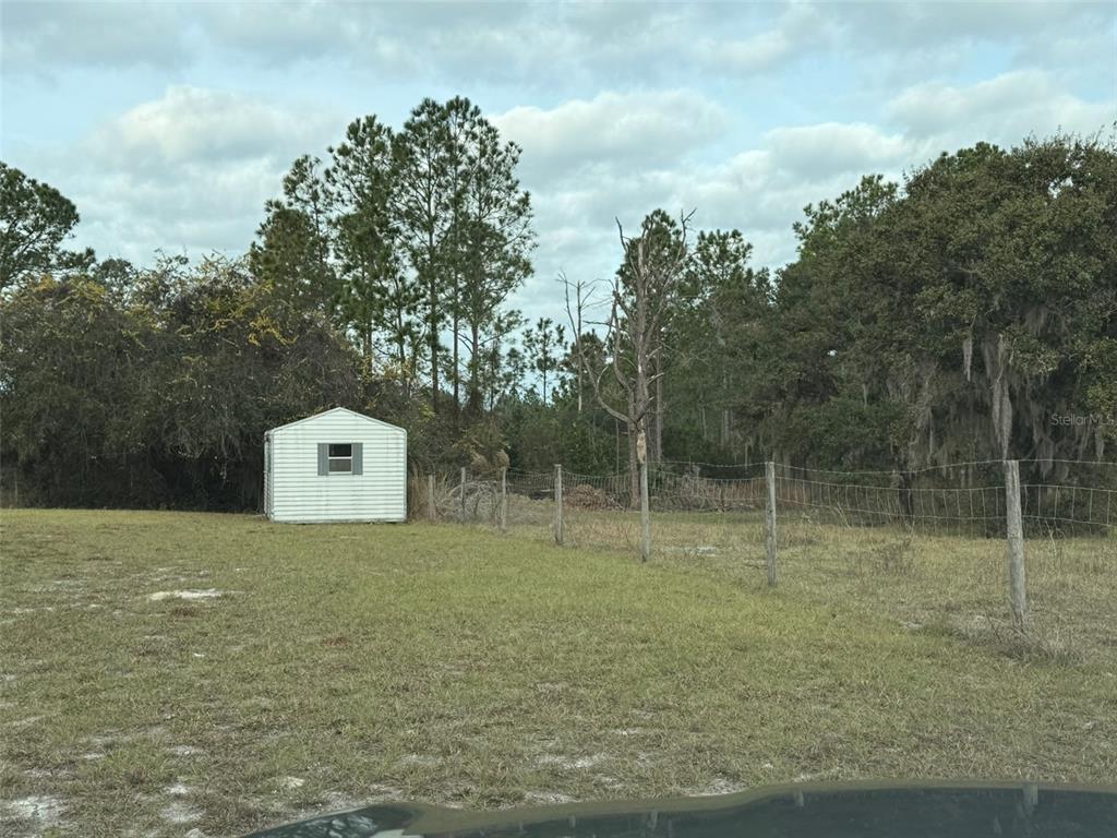 29605 Fullerville Road DeLand, FL 32720 - Photo 26 of 37 a view of a dry yard with trees