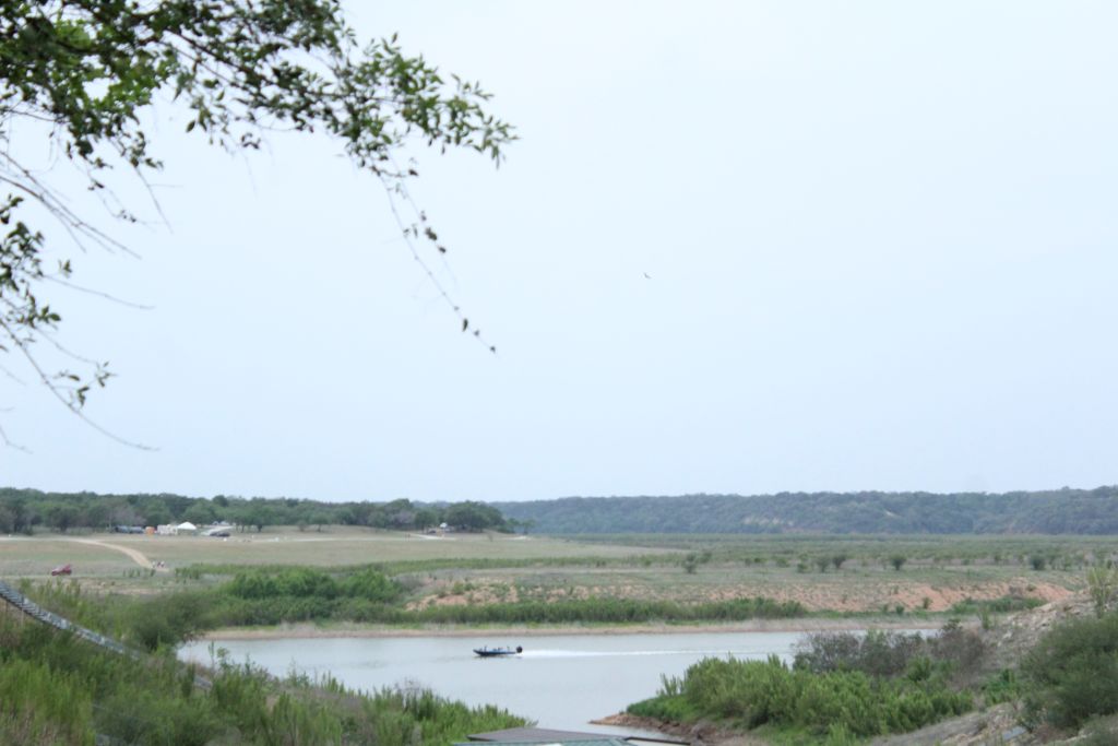5255 Lookout Ridge Drive Marble Falls, TX 78654 - Photo 32 of 40 Lake Travis view with cruising boat at lower drought lake levels