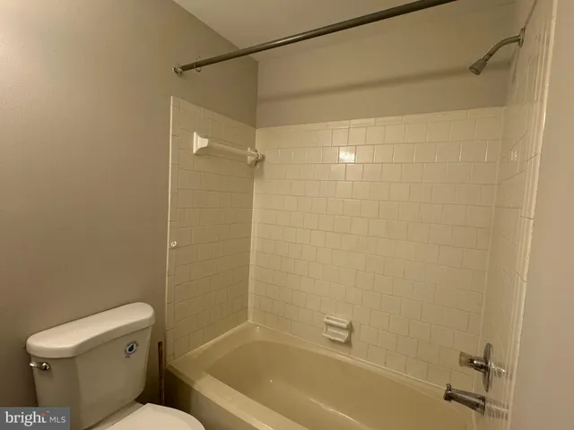 a bathroom with a toilet and shower