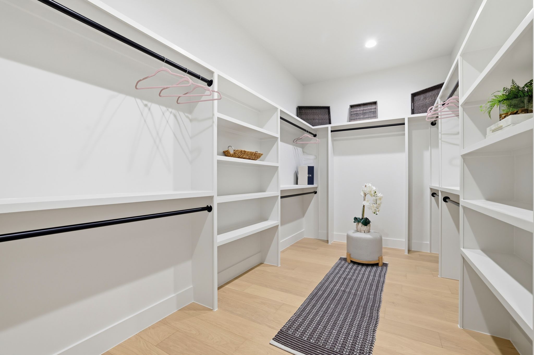 2908 Stoneway Drive Austin, TX 78757 - Photo 18 of 35 a view of walk in closet with empty racks