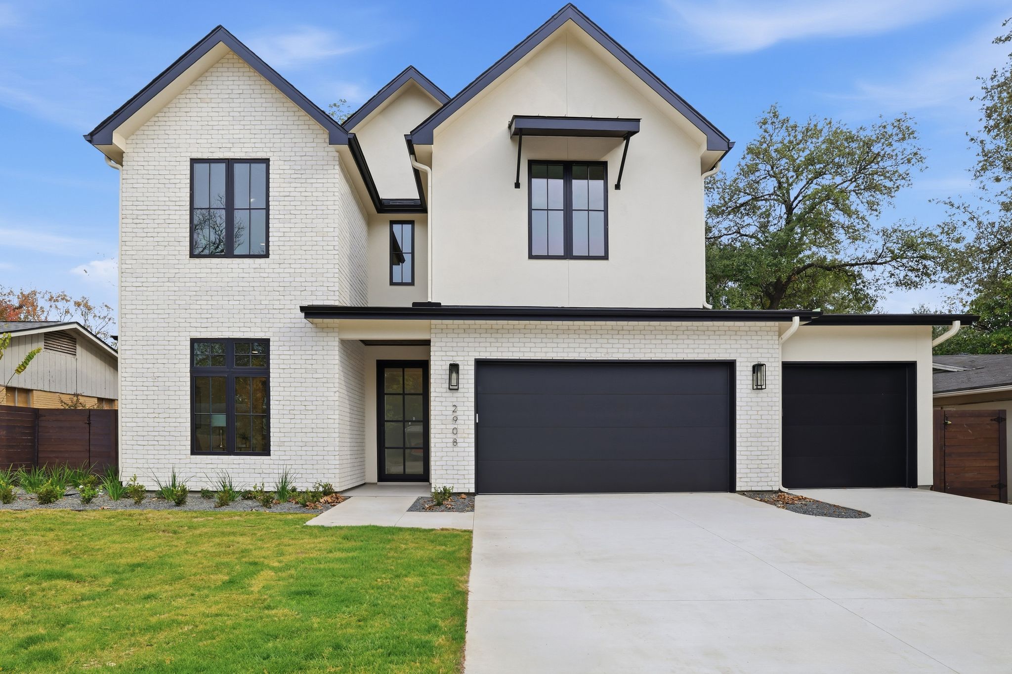 2908 Stoneway Drive Austin, TX 78757 - Photo 2 of 35 a front view of a house with a yard and garage