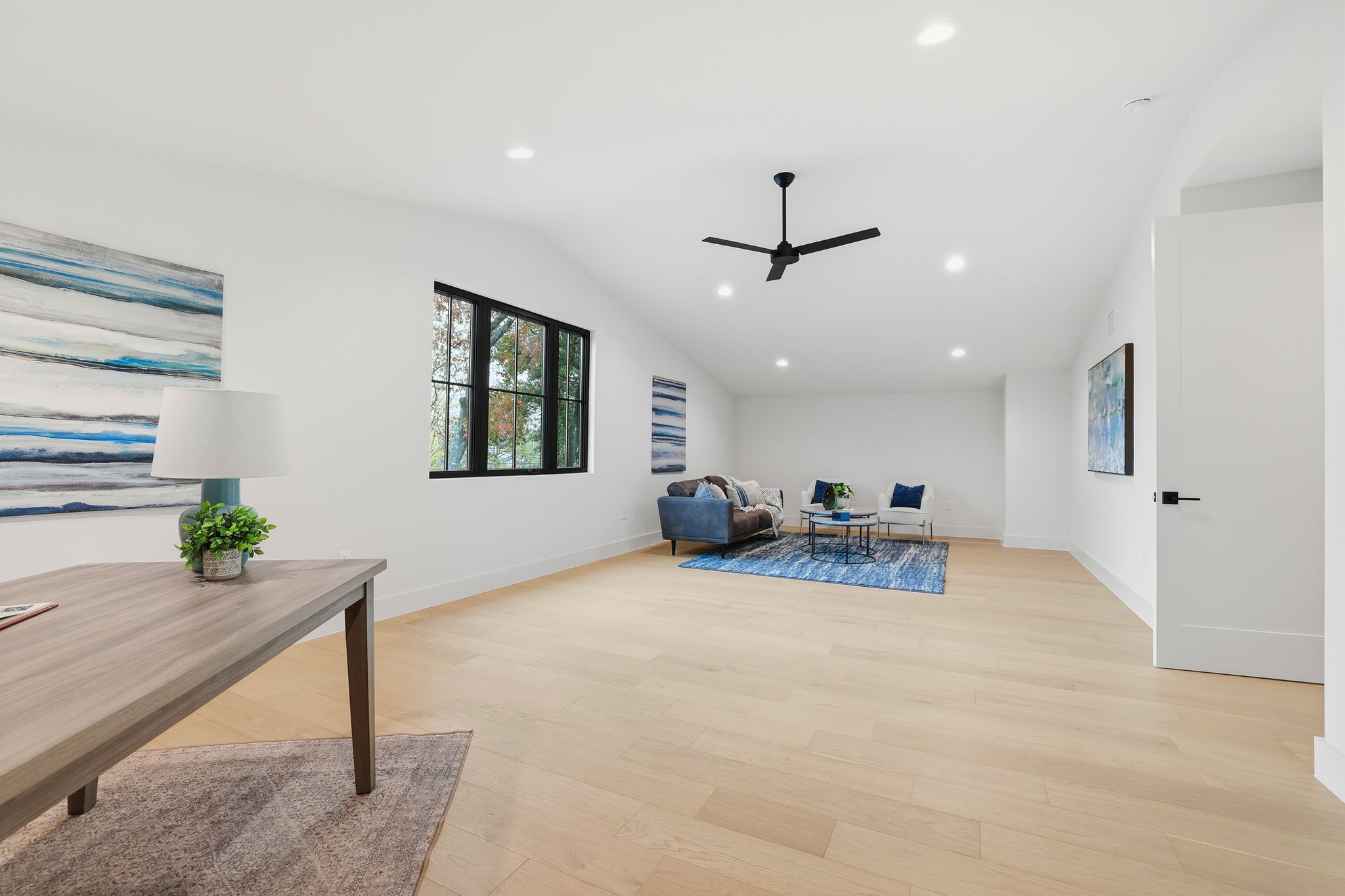 2908 Stoneway Drive Austin, TX 78757 - Photo 21 of 35 a view of a livingroom with furniture and a ceiling fan