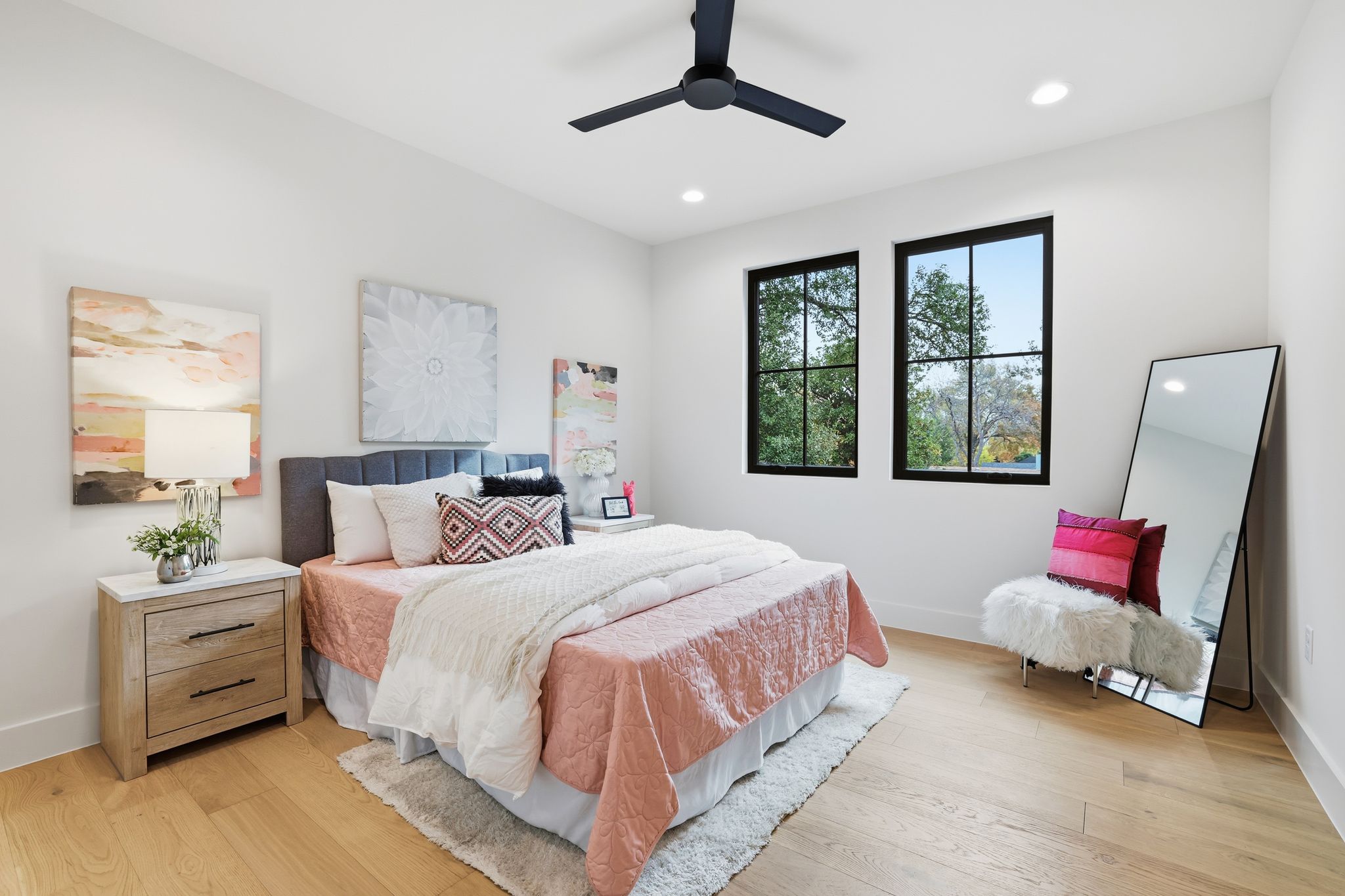 2908 Stoneway Drive Austin, TX 78757 - Photo 23 of 35 a bedroom with a bed a couch and window