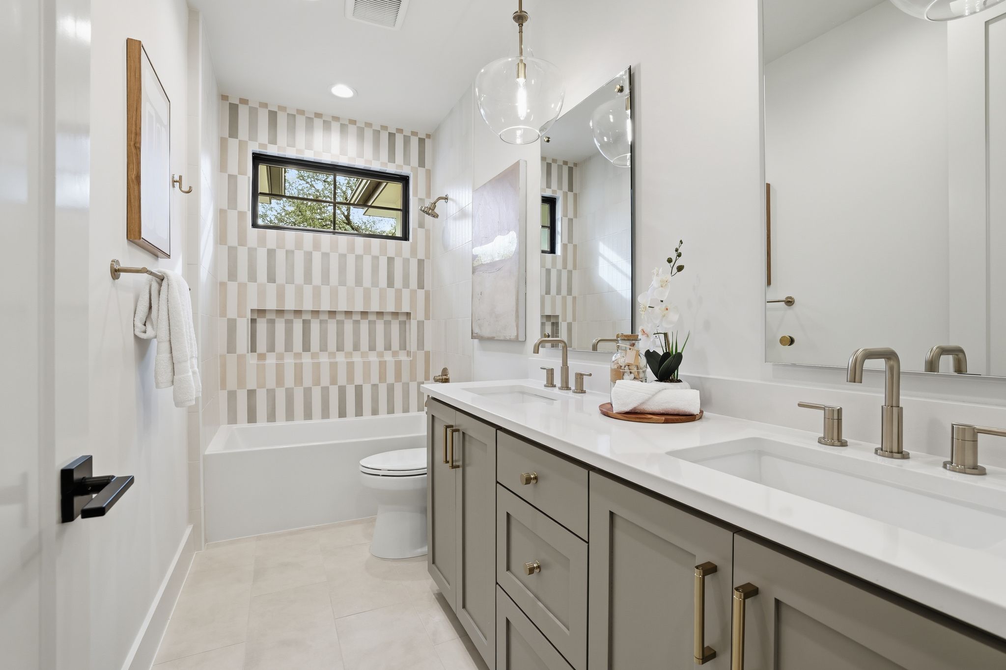 2908 Stoneway Drive Austin, TX 78757 - Photo 24 of 35 a bathroom with a double vanity sink toilet and shower
