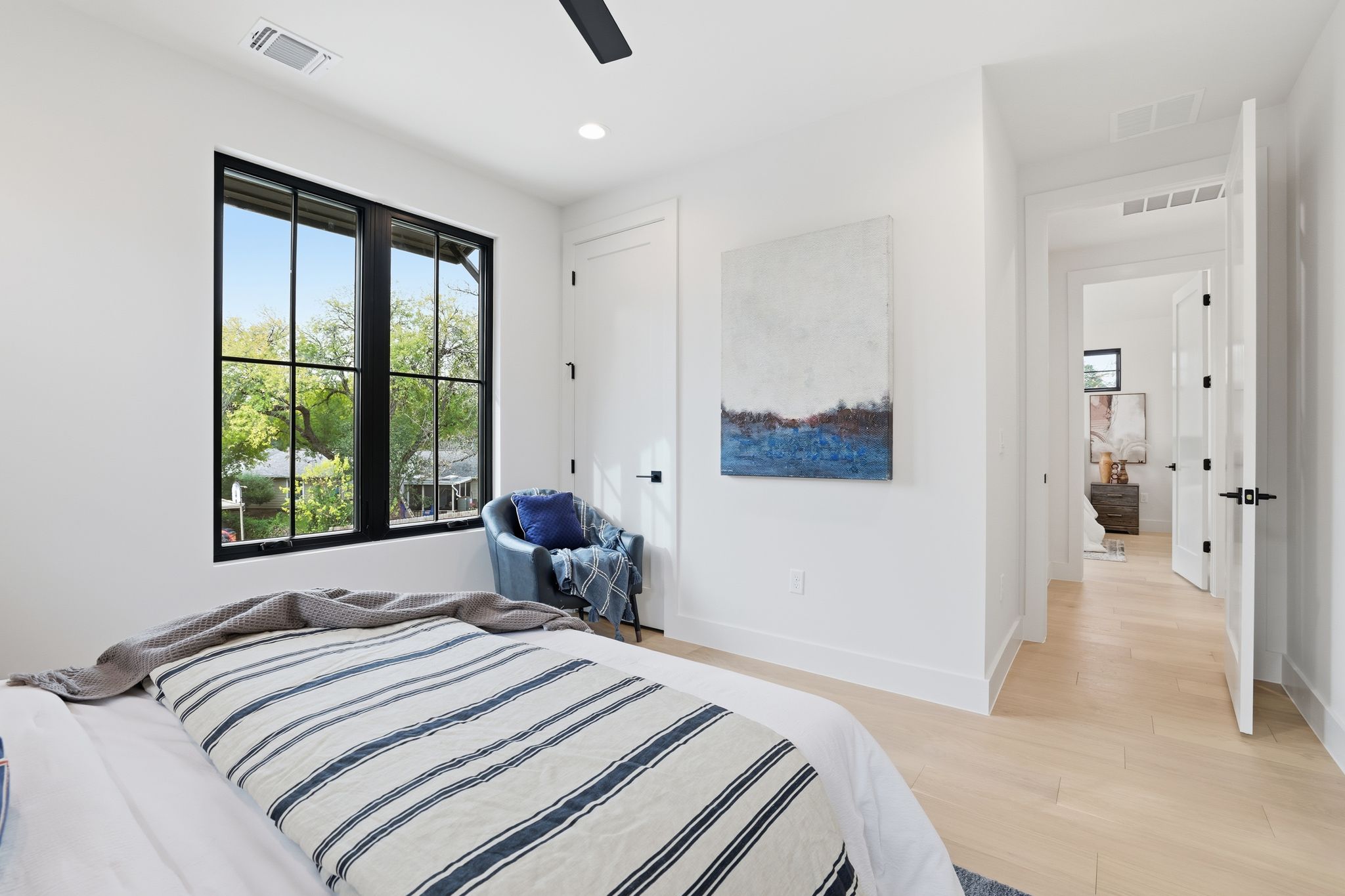2908 Stoneway Drive Austin, TX 78757 - Photo 26 of 35 a bedroom with a large bed and a window