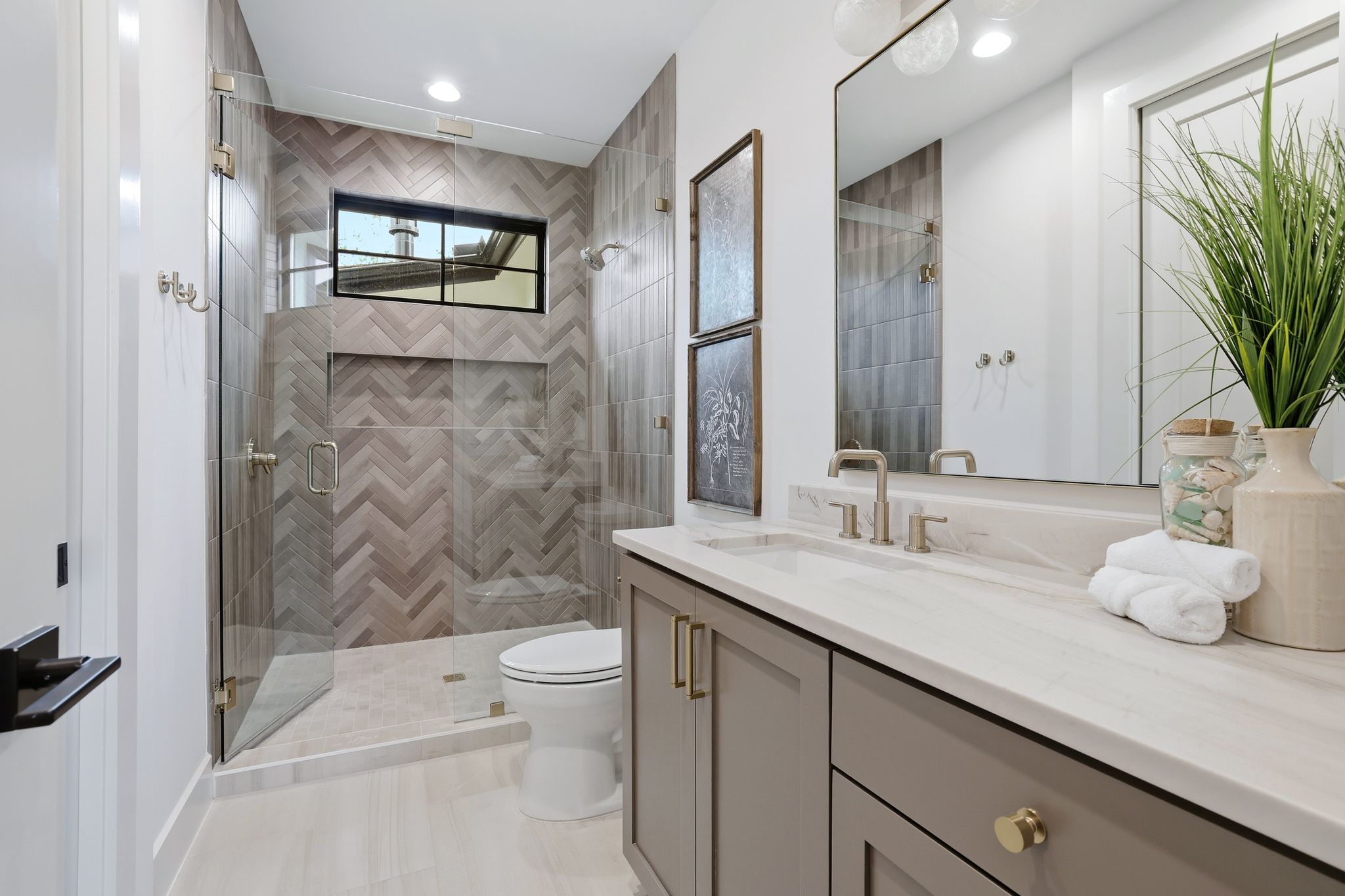 2908 Stoneway Drive Austin, TX 78757 - Photo 27 of 35 a bathroom with a granite countertop sink a toilet and shower