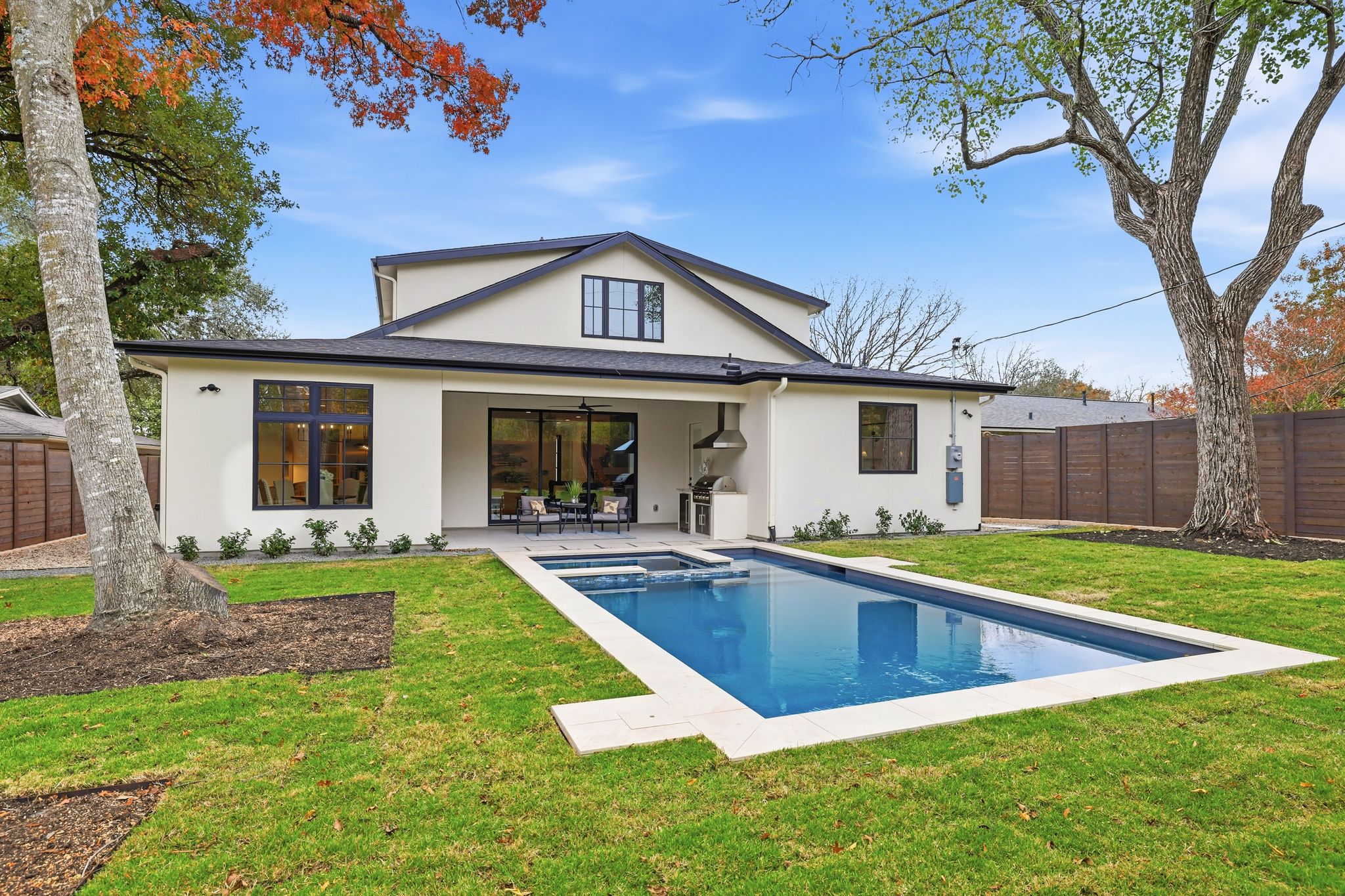 2908 Stoneway Drive Austin, TX 78757 - Photo 32 of 35 a view of a house with swimming pool and a yard