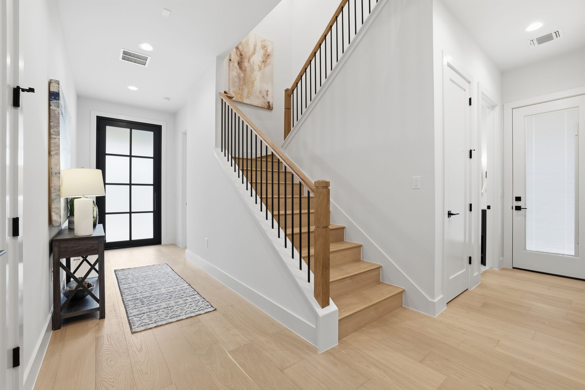 2908 Stoneway Drive Austin, TX 78757 - Photo 5 of 35 a view of an entryway with staircase