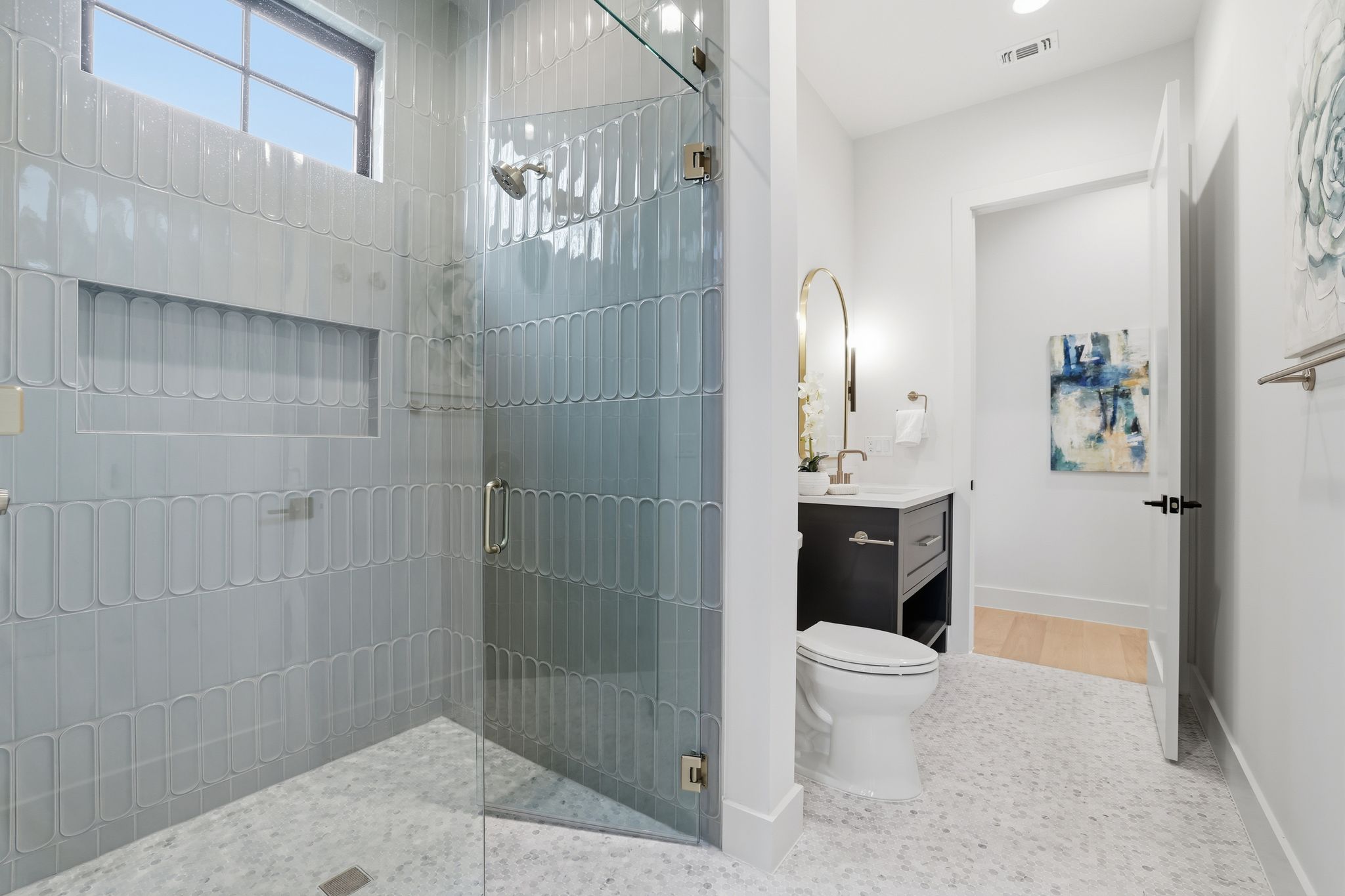 2908 Stoneway Drive Austin, TX 78757 - Photo 7 of 35 a bathroom with a toilet a sink and shower