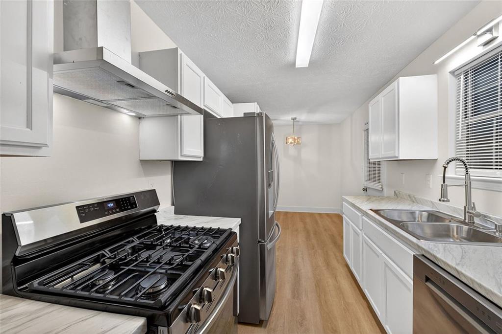 37 Peach Forest Way Douglasville, GA 30134 - Photo 15 of 30 a kitchen with a stove and a sink