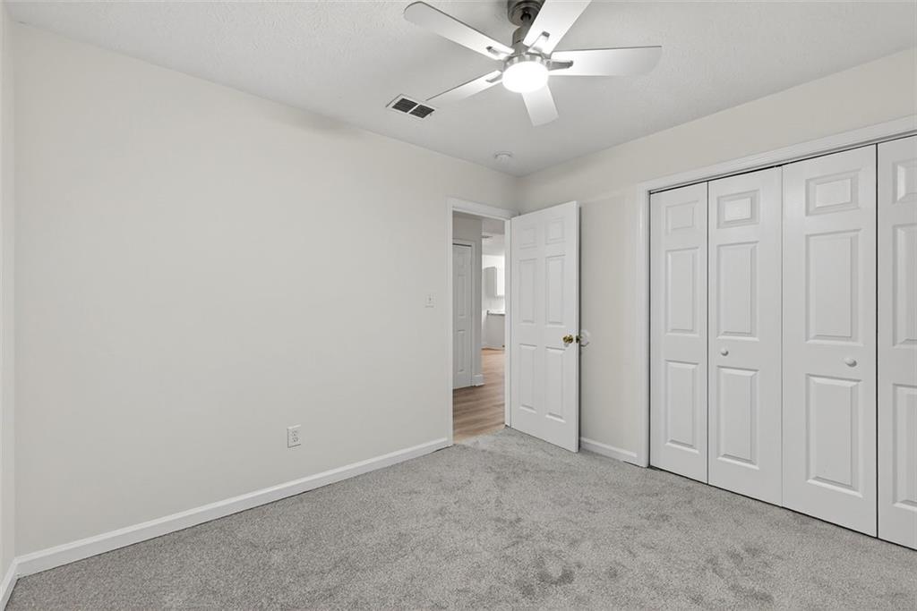 37 Peach Forest Way Douglasville, GA 30134 - Photo 21 of 30 an empty room with a ceiling fan and a window