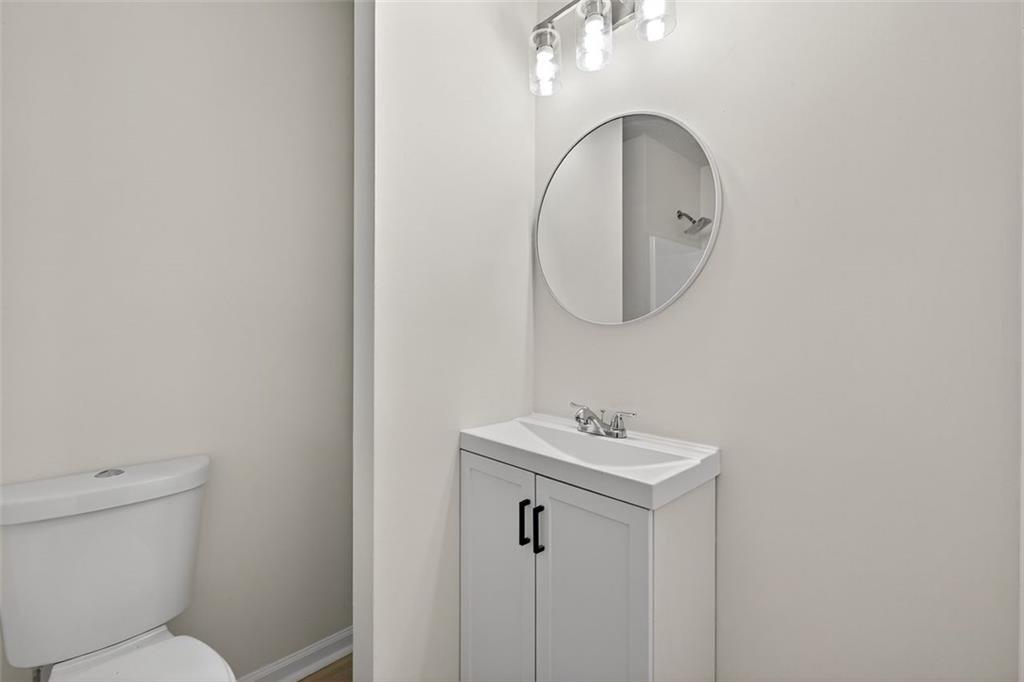 37 Peach Forest Way Douglasville, GA 30134 - Photo 10 of 30 a bathroom with a sink mirror and toilet