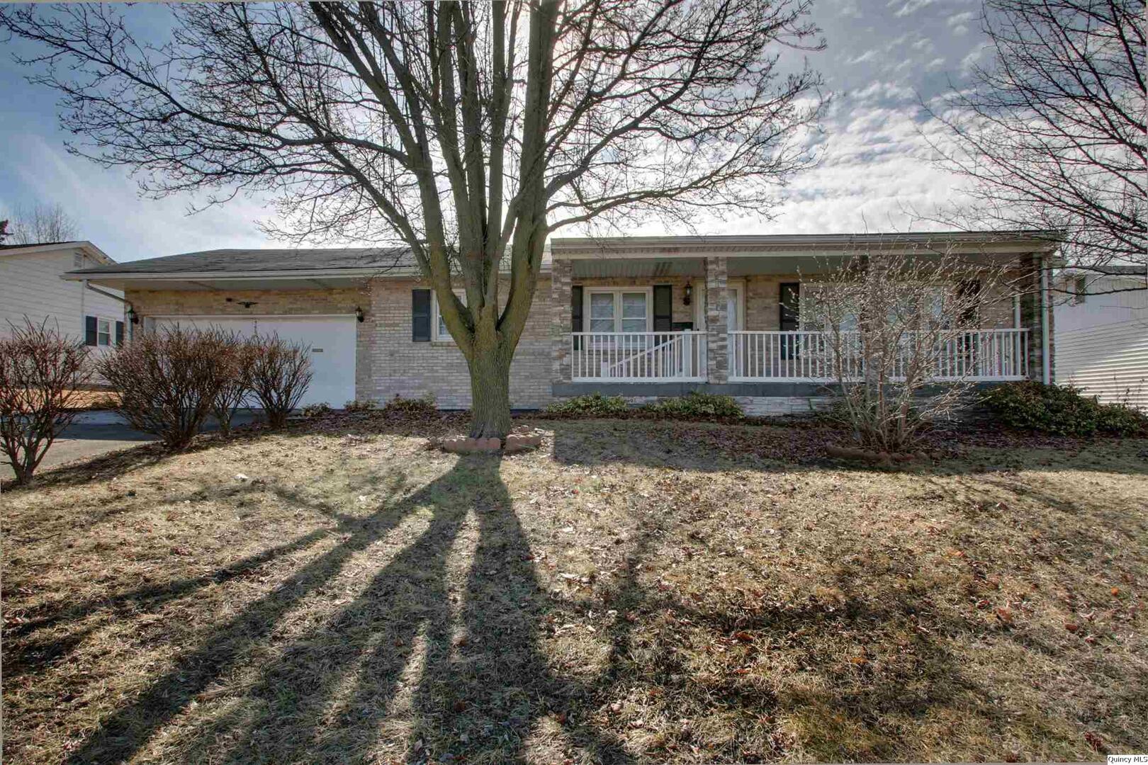 3608 Columbus Road Quincy, IL 62305 - Photo 1 of 17 a front view of a house with garden