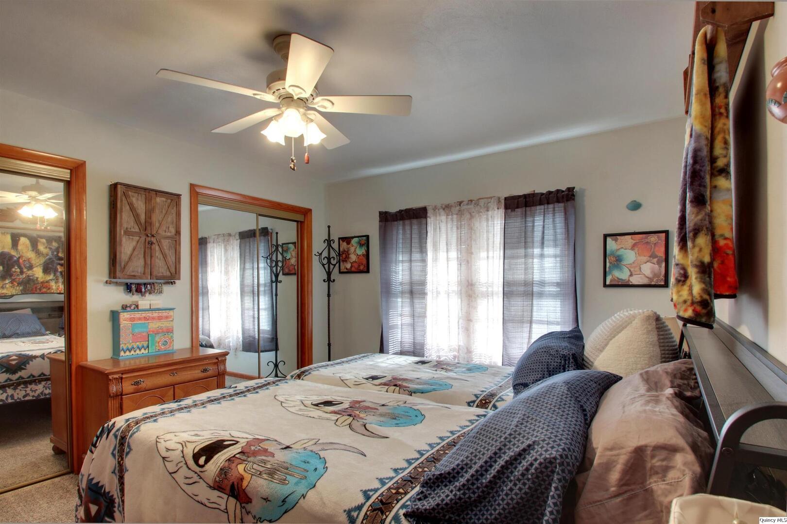 3608 Columbus Road Quincy, IL 62305 - Photo 16 of 17 a bedroom with a bed couch and a window