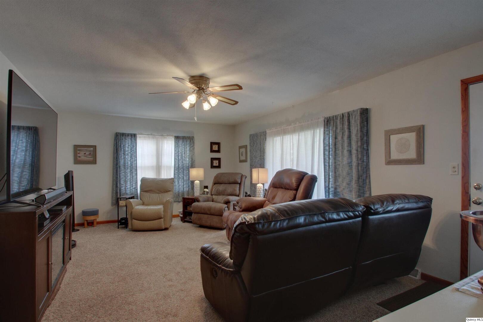 3608 Columbus Road Quincy, IL 62305 - Photo 7 of 17 a living room with furniture ceiling fan and a window