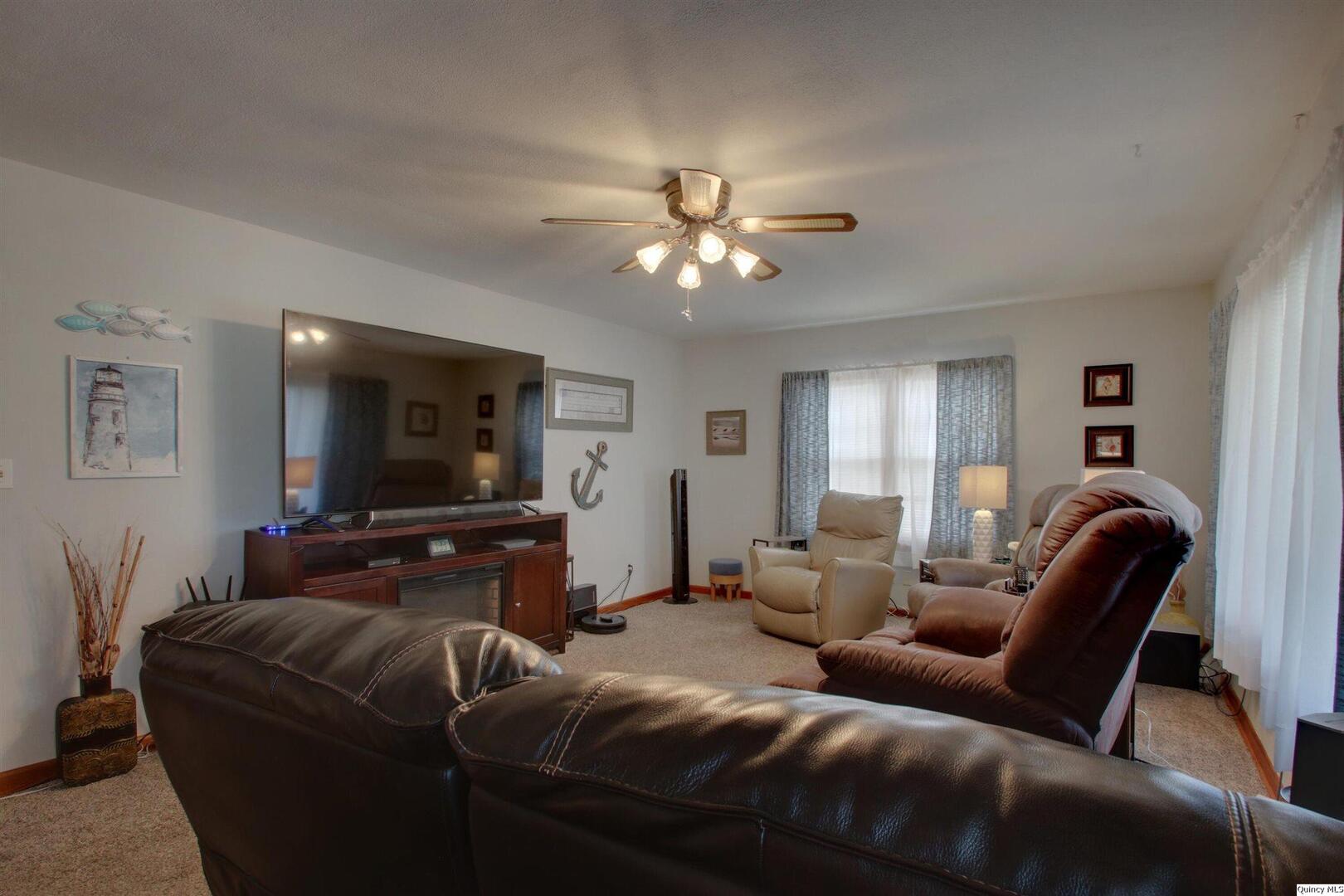 3608 Columbus Road Quincy, IL 62305 - Photo 9 of 17 a living room with furniture and a flat screen tv