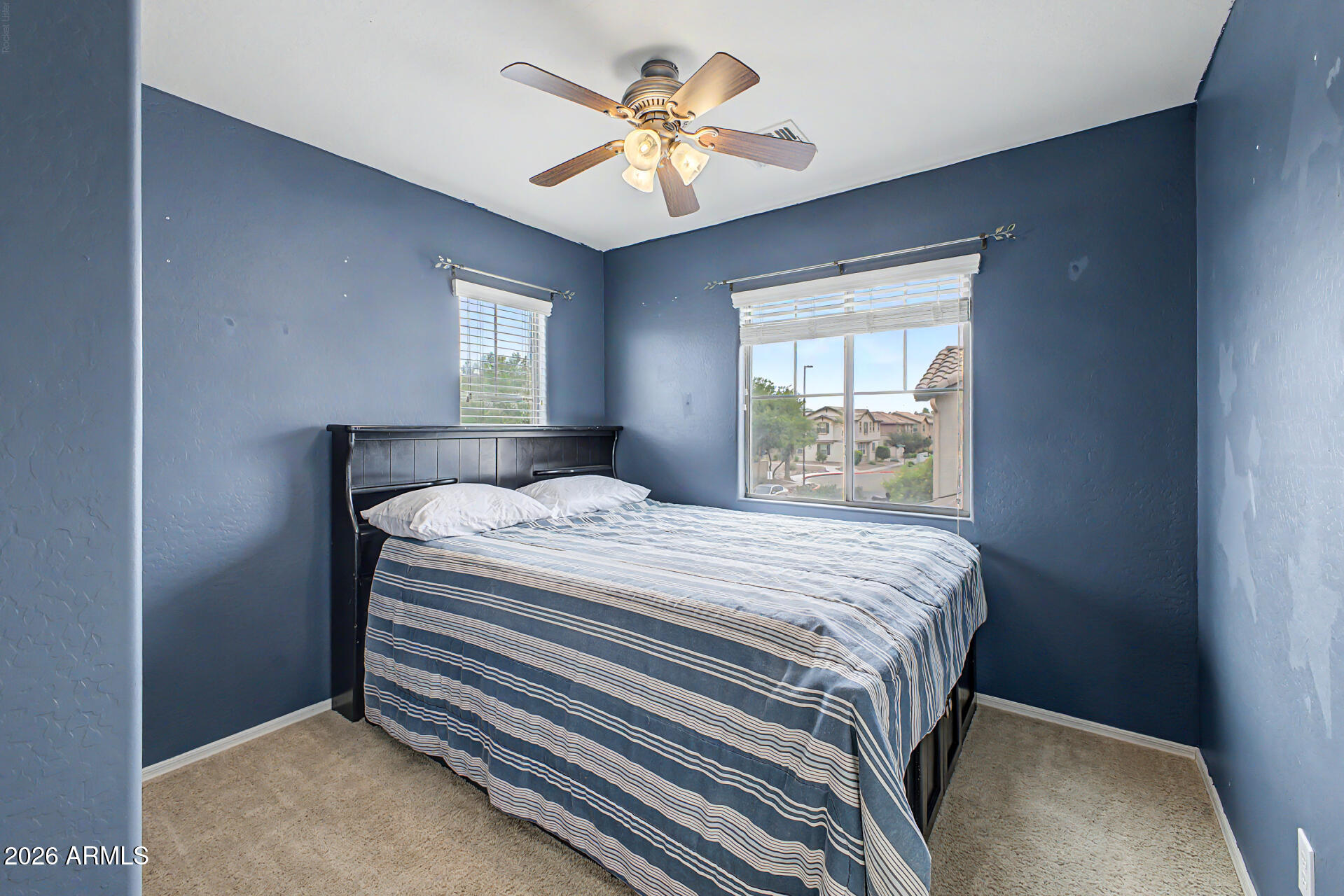 435 North Ranger Trail Gilbert, AZ 85234 - Photo 15 of 20 a bedroom with a bed and a chandelier