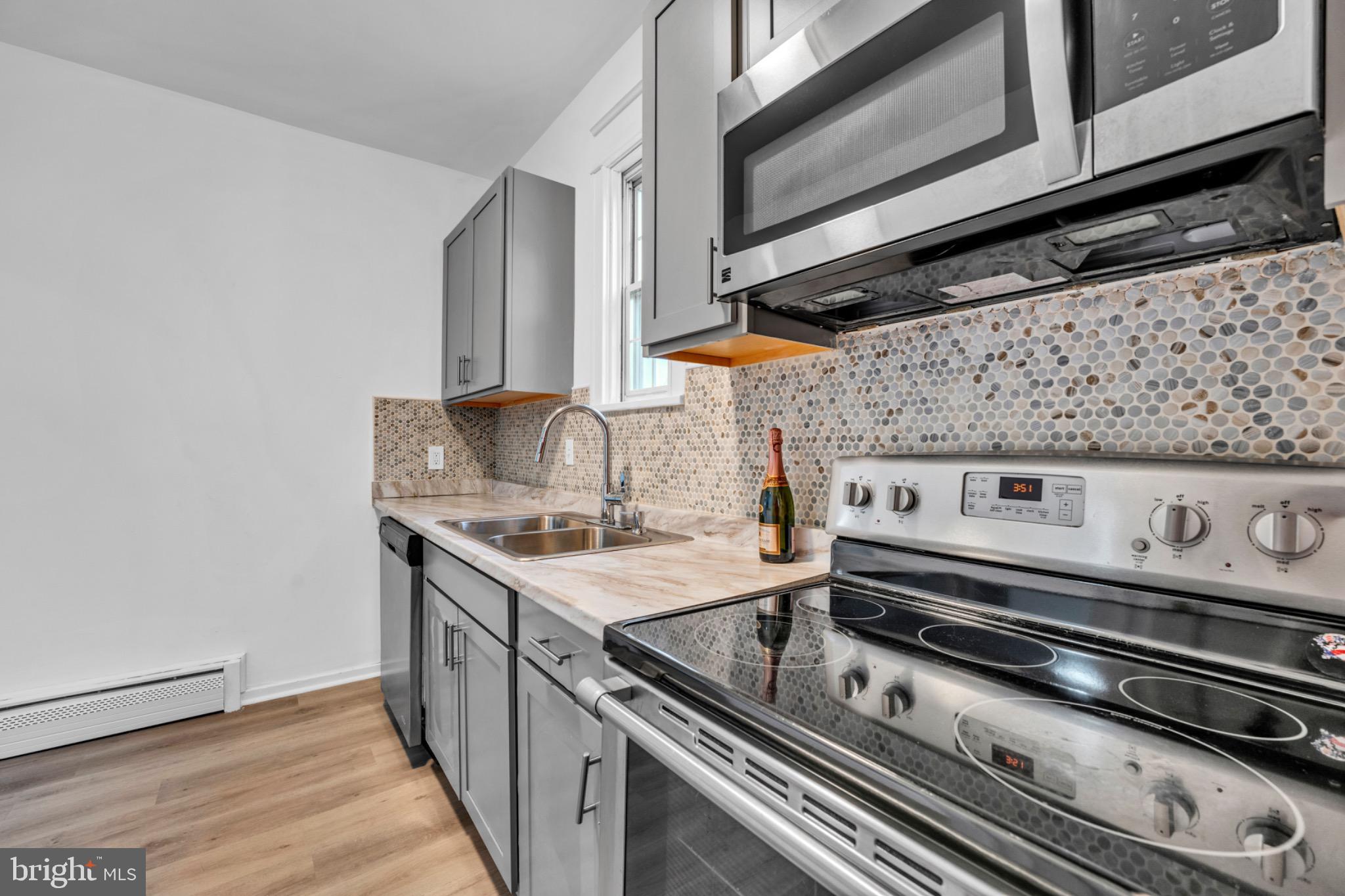 2219 Chesterfield Avenue Baltimore, MD 21213 - Photo 14 of 30 Modern kitchen with stylish finishes.