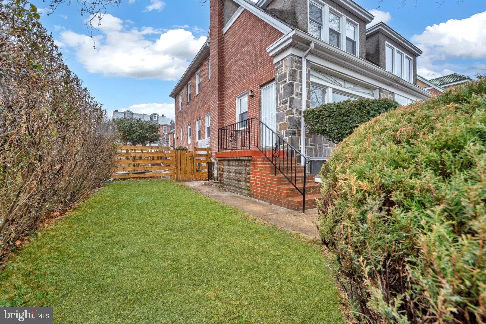 2219 Chesterfield Avenue Baltimore, MD 21213 - Photo 28 of 30 Charming brick home with lush greenery.