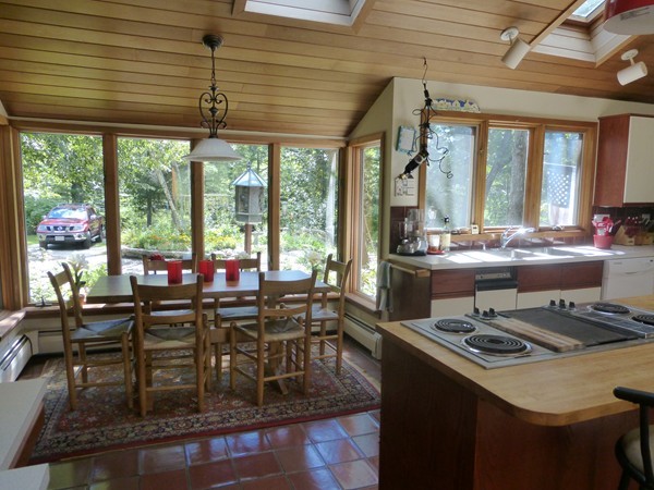 425 Taylor Road Stow, MA 01775 - Photo 11 of 28 a view of a dining room with furniture large windows and wooden floor