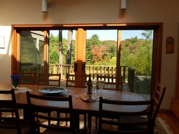 425 Taylor Road Stow, MA 01775 - Photo 15 of 28 a view of a city from a dining room with furniture and window