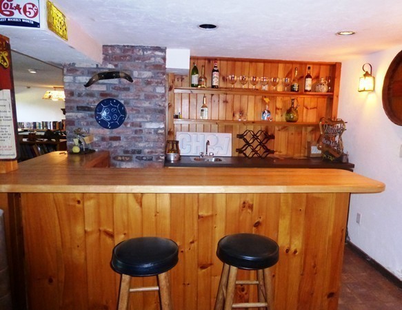 425 Taylor Road Stow, MA 01775 - Photo 20 of 28 a kitchen with a table and chairs in it