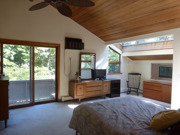 425 Taylor Road Stow, MA 01775 - Photo 21 of 28 a spacious bedroom with a large bed and a tv