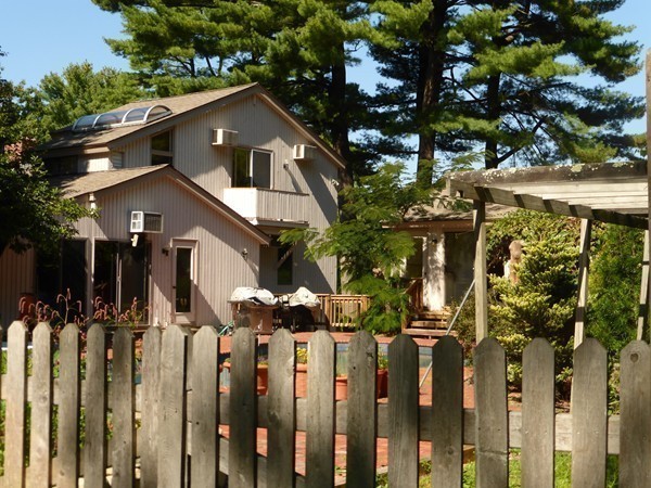425 Taylor Road Stow, MA 01775 - Photo 25 of 28 a front view of a house with a yard