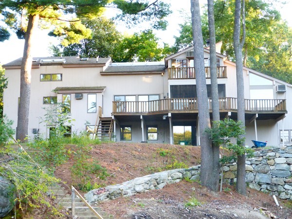 425 Taylor Road Stow, MA 01775 - Photo 3 of 28 a front view of a house with garden
