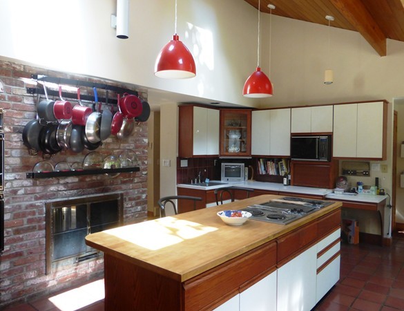 425 Taylor Road Stow, MA 01775 - Photo 10 of 28 a kitchen with a stove and a kitchen island