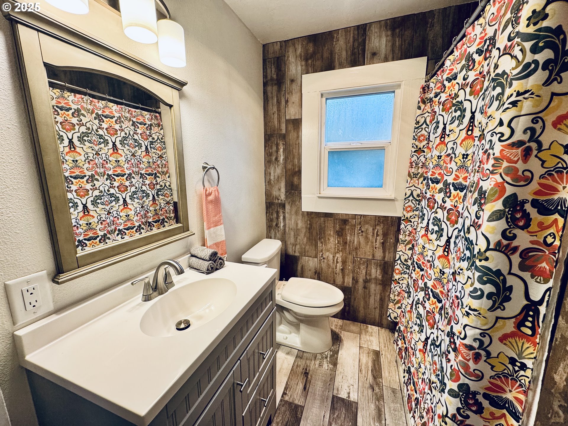1522 B Street Springfield, OR 97477 - Photo 11 of 22 a bathroom with a sink and a mirror