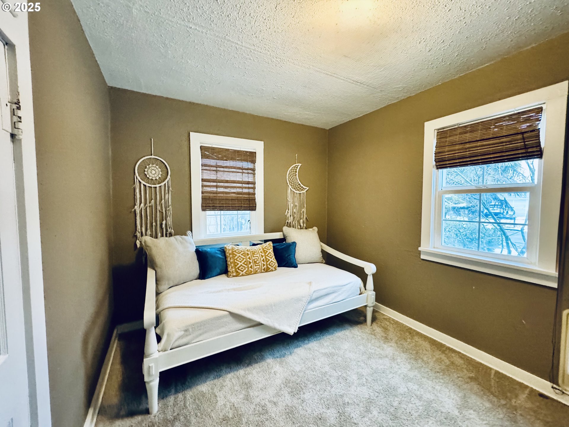 1522 B Street Springfield, OR 97477 - Photo 12 of 22 a bedroom with a bed lamp and a window