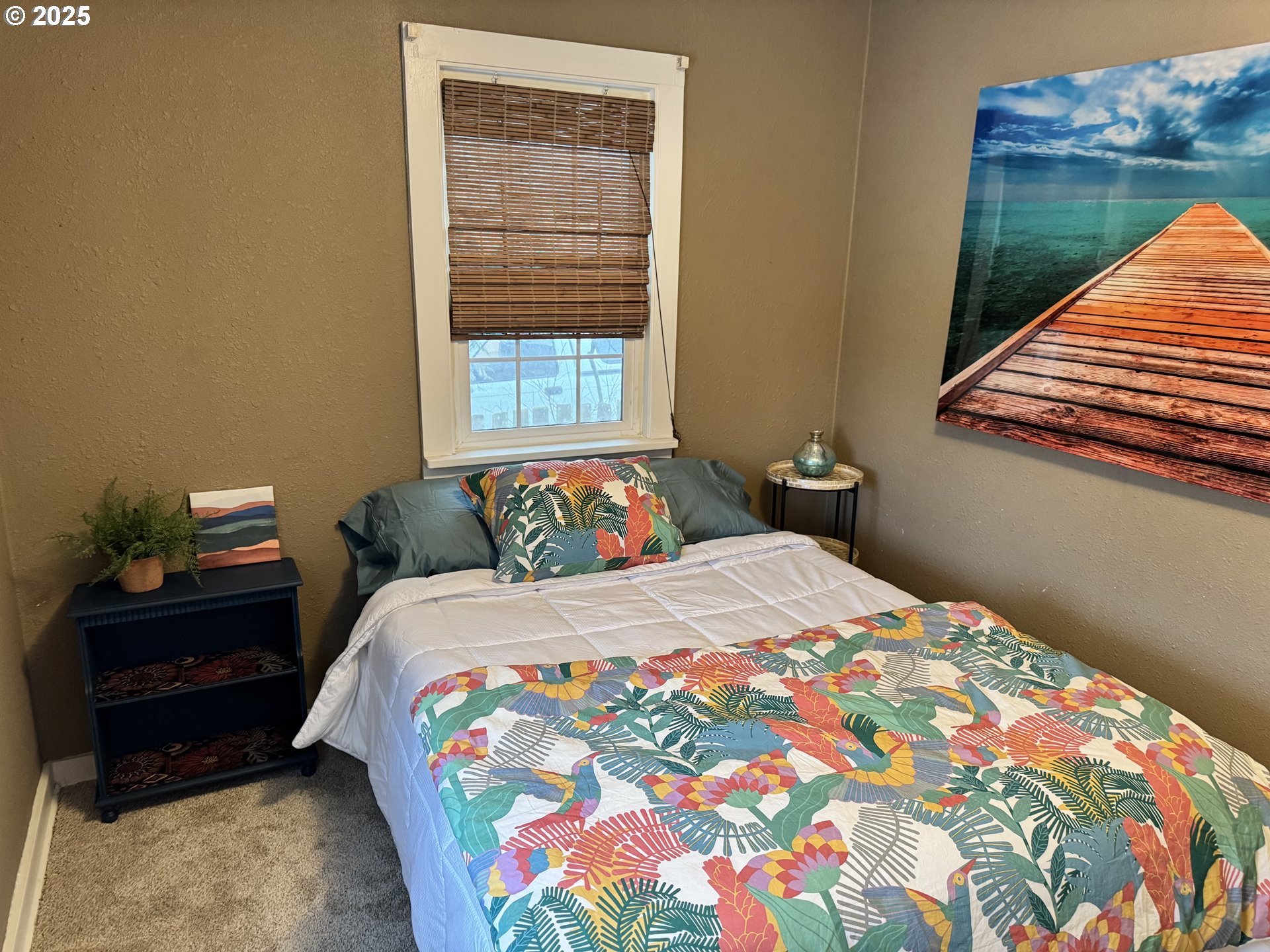 1522 B Street Springfield, OR 97477 - Photo 13 of 22 a bedroom with a bed and a lamp on dresser