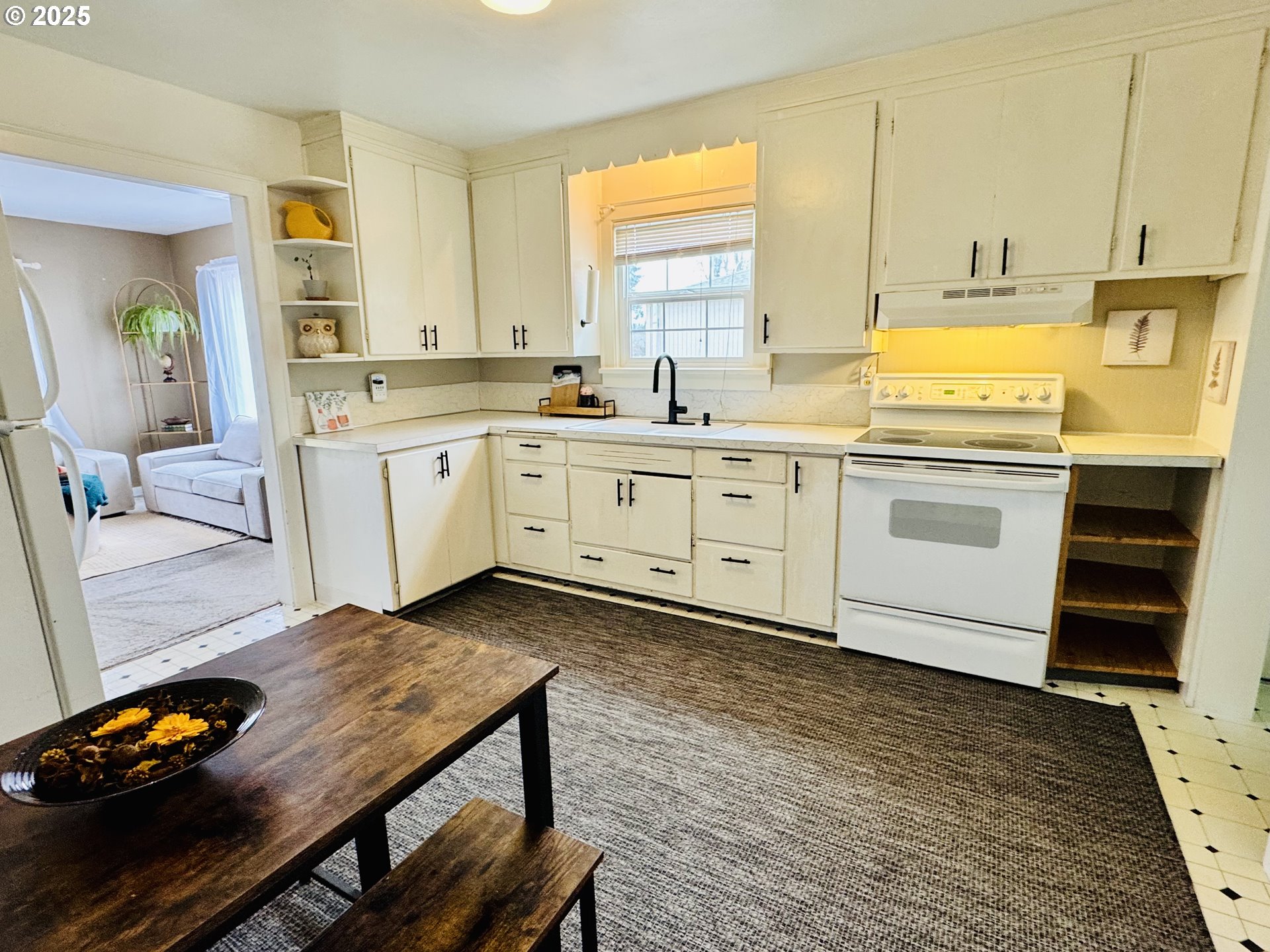 1522 B Street Springfield, OR 97477 - Photo 7 of 22 a kitchen with cabinets a sink and appliances